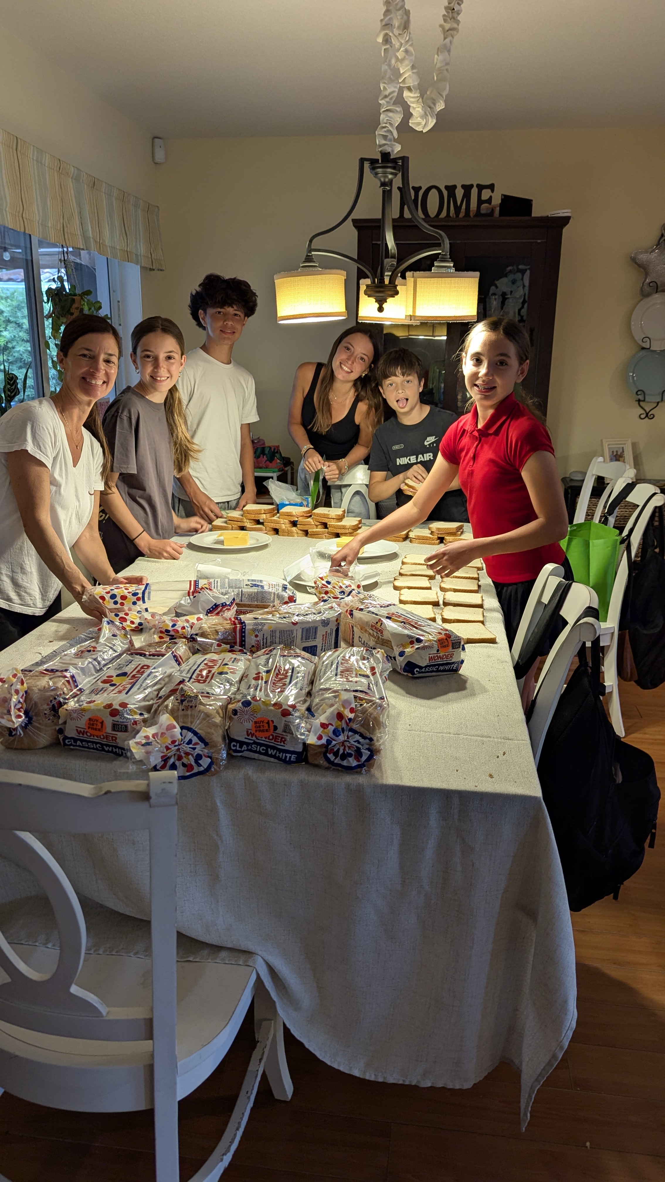 Members making sandwiches for a food bank drive